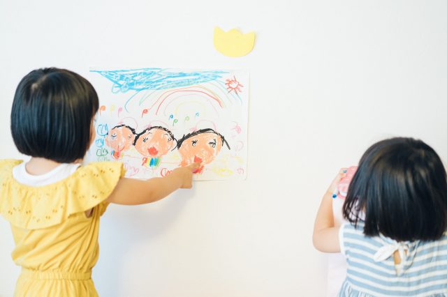 Two children engaging in family therapy and art therapy